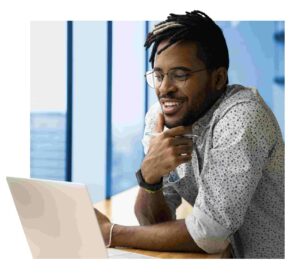 Smiling biracial man work online on laptop